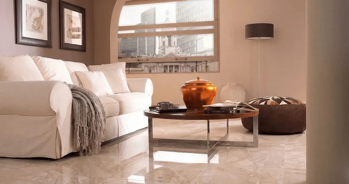 Modern living room with professionally installed marble flooring, a beige sofa, coffee table in Toledo, OH
