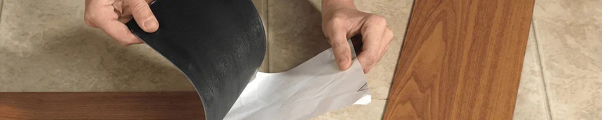 A professional installing vinyl flooring in Toledo, OH